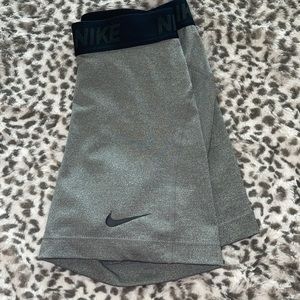 gray nike athletic shorts (spandex)
